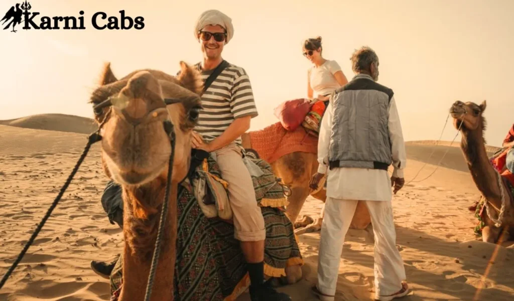 Experience a camel trek followed by an overnight stay in a desert camp_